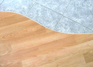 The curved tile to wood transition idea