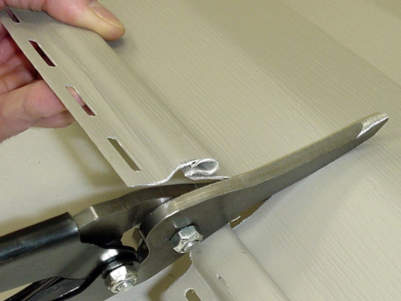 Cut the Vinyl Siding with Tin Snips