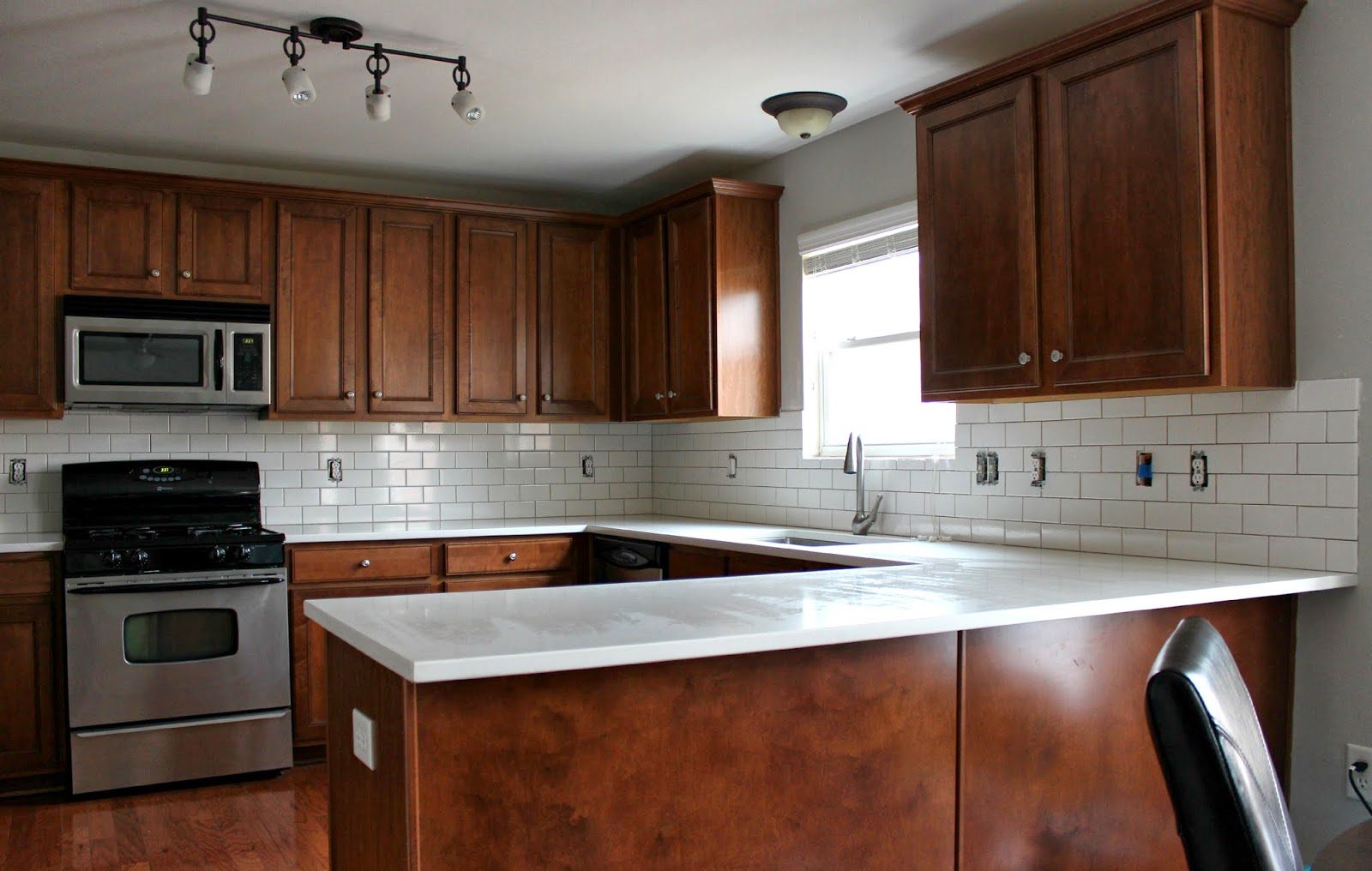 White Subway Tile Backslpash with Brown Grout