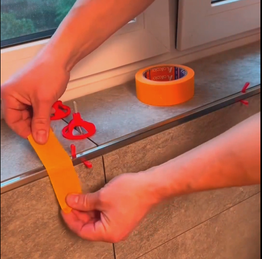 Securing tiles with tape