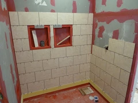 tile shower floor or wall first